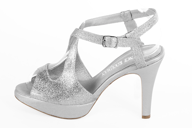 Light silver women's open back sandals, with crossed straps. Round toe. Very high slim heel with a platform at the front. Profile view - Florence KOOIJMAN